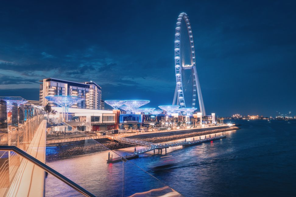 A contemporary architectural marvel featuring a colossal Ferris wheel on Blue Waters Island